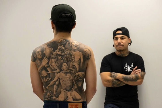 He quit his job to become a tattoo artist. Now his shop has a yearlong wait list