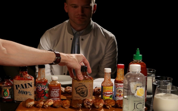 This guy eats hot wings with celebrities for a living. Seriously.