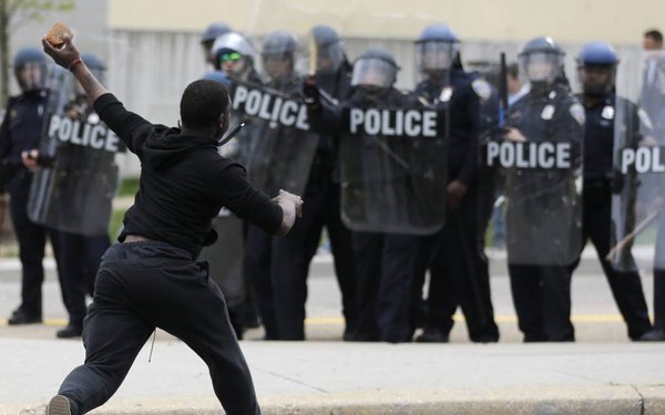 Baltimore erupts after burial of police victim