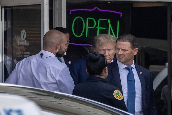 Trump tells restaurant patrons ‘Food for everyone!’ then leaves without paying